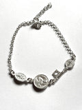 pulsera triple protección llave San Benito, San judas Tadeo y virgen milagrosa