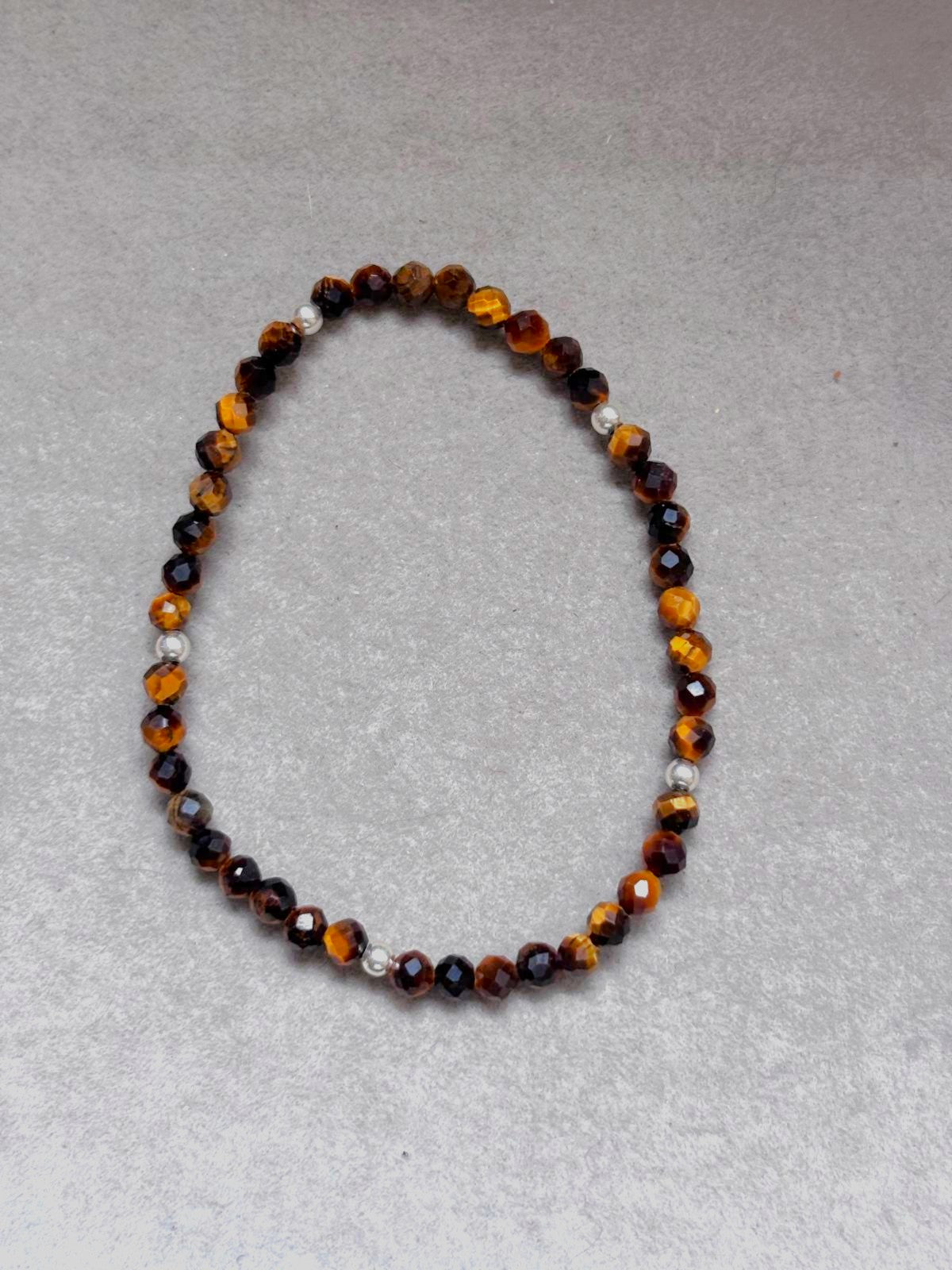 Pulsera Elástica Ojo de Tigre Facetado · Plata 925